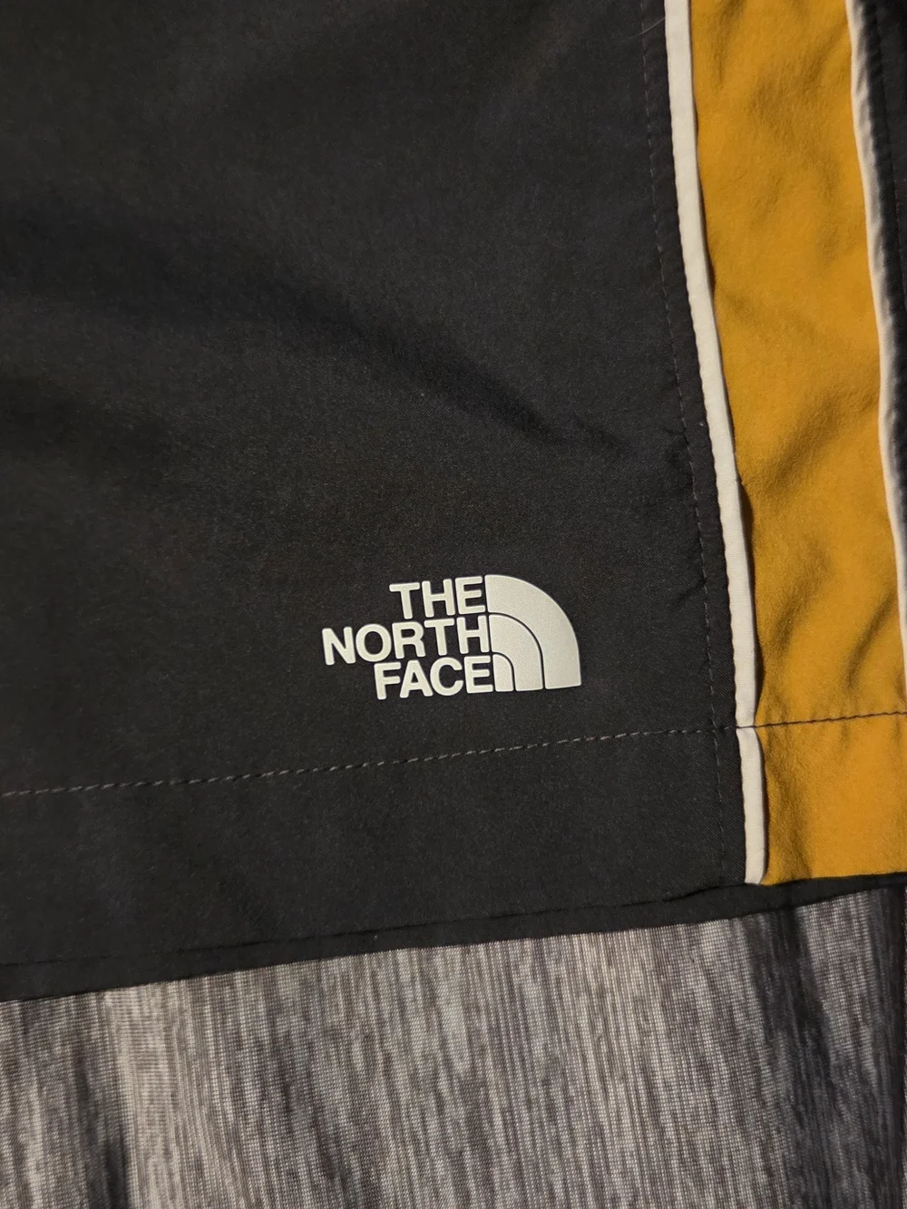 The North Face ELEVATION Black Athletic Shorts with Yellow Side Men Med.